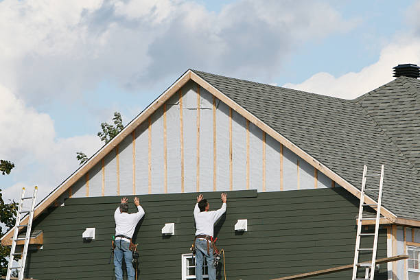 Professional Storm Damage Siding Repair technician working in Trenton, FL